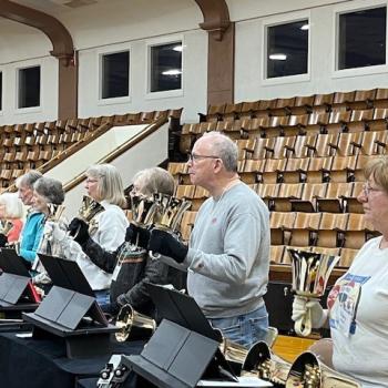Bell ringers with their bells at the ready, waiting for the downbeat
