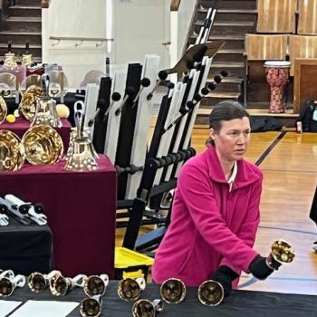 A bell ringer performing a solo piece