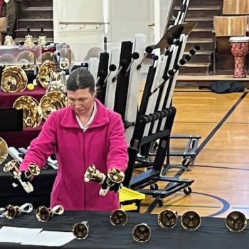 A bell ringer performing a solo piece