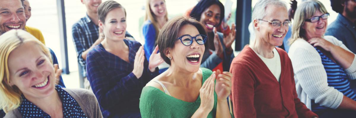 Happy group of adults applauding or clapping, adult ministry or bible study concept